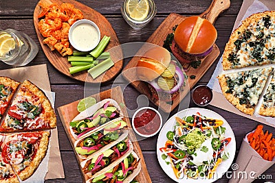 Healthy plant based fast food table scene. Overhead view on a wood background. Stock Photo