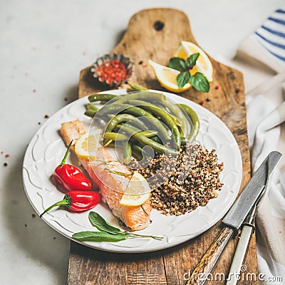 Healthy protein rich dinner plate with roasted salmon and quinoa Stock Photo