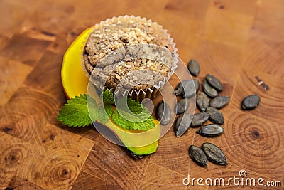 Healthy pumpkin muffins, vegan baked food, autumn dessert on wood background Stock Photo