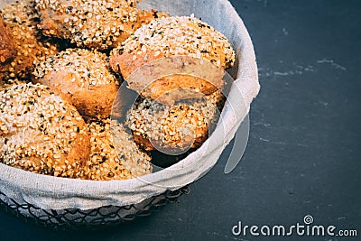 Healthy quinoa linseed bun in a rustic basket Stock Photo