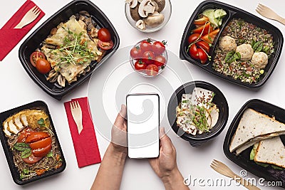 Healthy restaurant food delivery in your cellphone Stock Photo