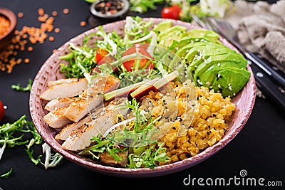 Healthy salad with chicken, tomatoes, avocado, lettuce, watermelon radish Stock Photo