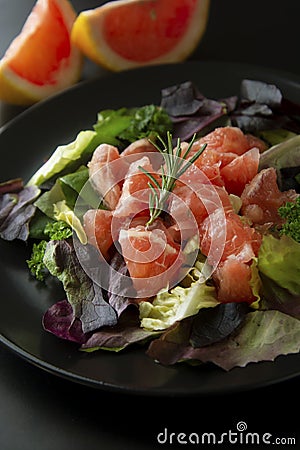 Healthy salad grapefruit and green leaves. Deliciouse dietary food. lose weigh Stock Photo