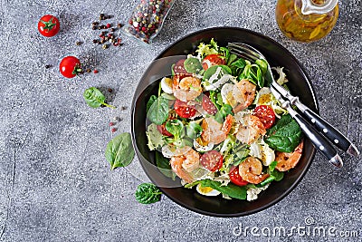 Healthy salad plate. Fresh seafood recipe. Grilled shrimps and fresh vegetable salad and egg. Grilled prawns. Healthy food. Flat l Stock Photo