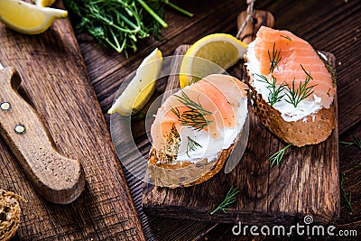 Healthy salmon with cottage cheese on serving board Stock Photo
