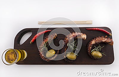 Healthy sea food detail - octopus, olives and pepper Stock Photo