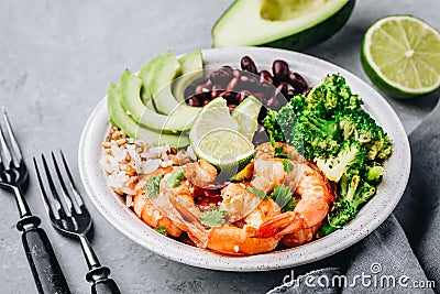Spicy Shrimp Burrito Buddha Bowl with wild rice, broccoli, black beans and avocado Stock Photo