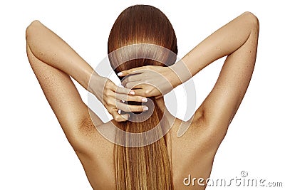 Healthy Shiny Long Hair in Tale. Beautiful Girl holding her Hair in hand. Back view on white. Hairstyle with strong Hair Stock Photo