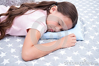 Healthy sleep tips. Girl sleeps on little pillow bedclothes background. Girl child long hair fall asleep pillow close up Stock Photo