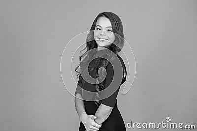 Healthy smile. Feeling lucky. Perfect girl. Positive emotions. Teen girl smiling orange background. Teen child with long Stock Photo