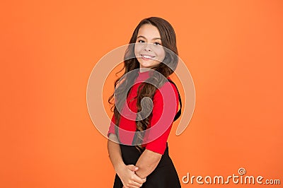 Healthy smile. Feeling lucky. Perfect girl. Positive emotions. Teen girl smiling orange background. Teen child with long Stock Photo