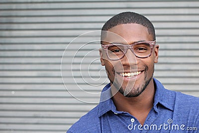 Healthy Smile. Teeth Whitening. Beautiful Smiling Young man Portrait close up. Over modern gray background . Laughing businessman Stock Photo