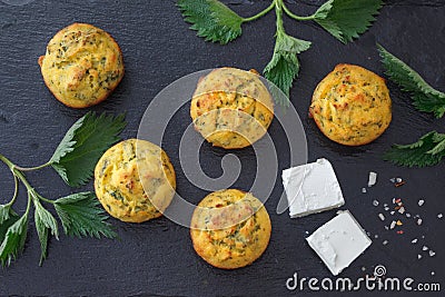 Healthy snack muffins with feta cheese and nettle. Stock Photo