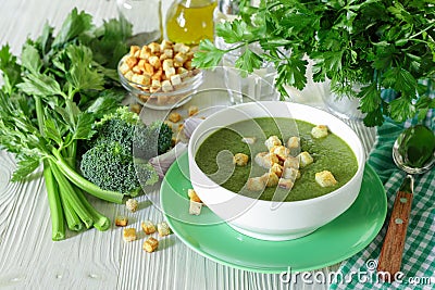 Healthy soup puree of broccoli, celery and herbs with croutons. Stock Photo