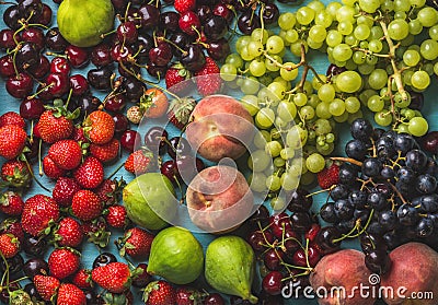 Healthy summer fruit variety. Black and green grapes, strawberries, figs, sweet cherries, peaches Stock Photo