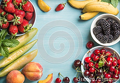 Healthy summer fruit variety. Sweet cherries, strawberries, blackberries, peaches, bananas, melon slices and mint leaves Stock Photo