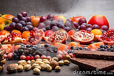 Healthy super food selection background as fruits, berry, chocolate High in antioxidants, magnesium, resveratrol, vitamins, Stock Photo