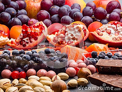 Healthy super food selection background as fruits, berry, chocolate High in antioxidants, magnesium, resveratrol, vitamins, Stock Photo