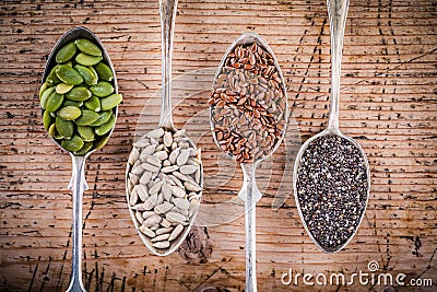 Healthy superfood: pumpkin seeds, sunflower seeds, flax seeds and chia Stock Photo