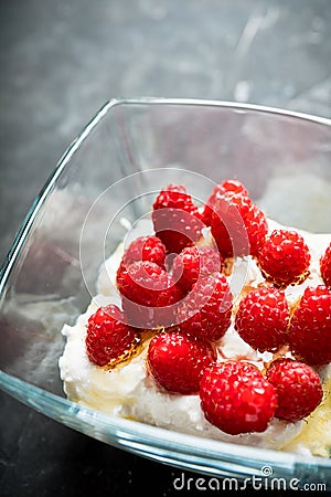 Healthy and tasty breakfast with curd, sour cream, raspberry and honey Stock Photo