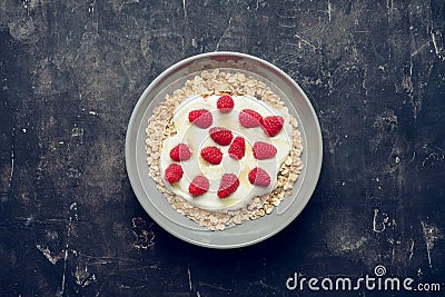Healthy and tasty breakfast with muesli, yogurt, raspberry and honey Stock Photo