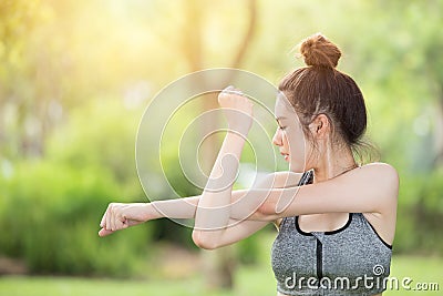 Healthy teen arm stretching sport outdoor exercise warm up Stock Photo