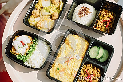 Healthy thai food concept. Four lunch box set on table Stock Photo