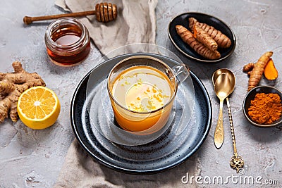 Healthy turmeric golden tea on light gray background Stock Photo