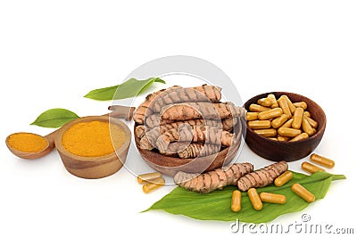 Healthy Turmeric Root Powder and Supplement Capsules Stock Photo