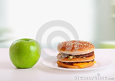 Healthy, unhealthy food. Diet concept: apple, ha Stock Photo