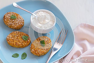 Healthy vegetable cutlets with carrot, dried apricots, almonds and herbs, breaded in oat bran Stock Photo