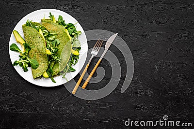 Healthy vegetable pancake. Spinach pancakes on black background top view copy space Stock Photo
