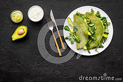 Healthy vegetable pancake. Spinach pancakes on black background top view copy space Stock Photo