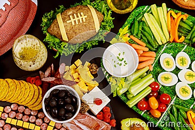 Healthy vegetable platter with meatloaf like a football ball for american football game party. Close up Stock Photo