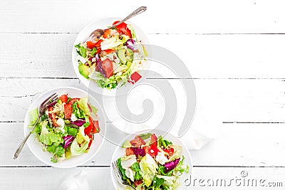 Healthy vegetable salad with fresh greens, lettuce, avocado, tomato, seet pepper and goat cheese. Delicious and nutritious diet di Stock Photo