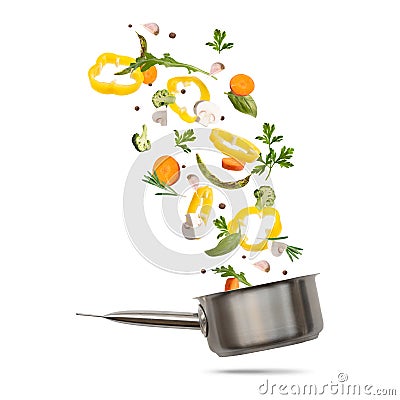 Healthy vegetarian eating and cooking with various flying chopped vegetables Stock Photo