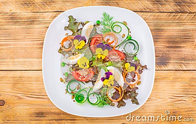 Healthy vegetarian summer salad with edible flowers Stock Photo