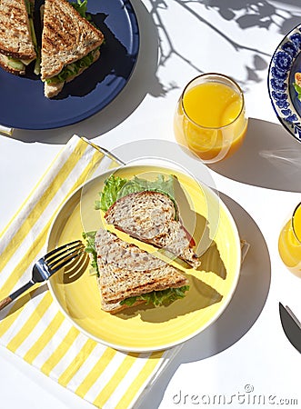 Healthy vegetarian wheat bran sandwich on the yellow plate. Breakfast concept flat lay. Stock Photo