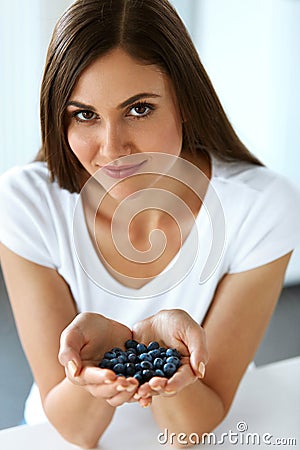 Healthy Vitamin Food. Beautiful Smiling Woman With Blueberries Stock Photo