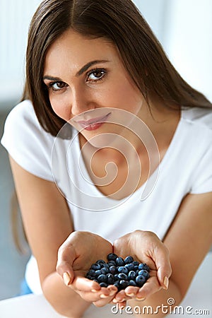 Healthy Vitamin Food. Beautiful Smiling Woman With Blueberries Stock Photo