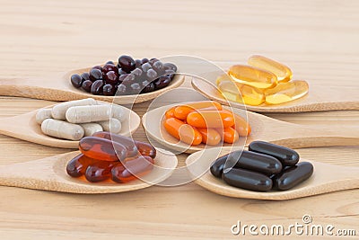 Healthy Vitamin upplement capsules in a spoons. Stock Photo