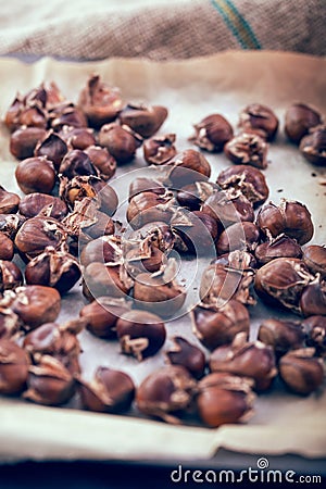 Healthy winter snack chestnuts on wooden background Stock Photo