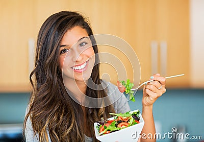 Healthy woman eating salad Stock Photo