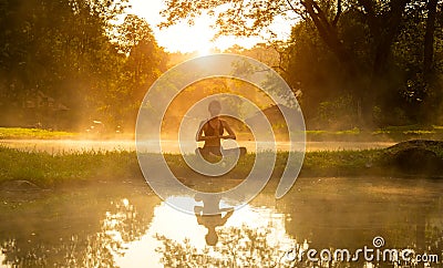 Healthy woman lifestyle exercising vital meditate and energy yoga in morning the spring nature background. Stock Photo