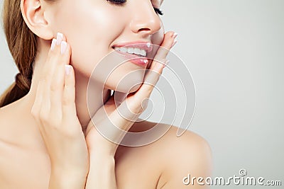 Healthy woman lips with glossy pink makeup and manicured hands with french manicure nails, face closeup Stock Photo