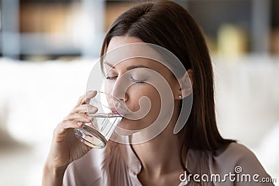 Healthy young woman drink pure mineral water Stock Photo