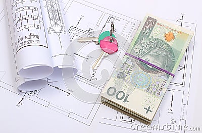 Heap of banknotes, keys and electrical diagrams on drawing of house Stock Photo