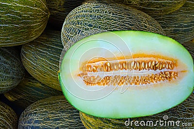 Heap of Big Ripe Organic Green and Yellow Spanish Frogs Skin Melons Mediterranean Farmers Market. Viivid Colors. Summer Harvest Stock Photo