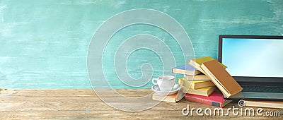 Heap of books,cup of coffee and laptop, learning,education, copy space Stock Photo