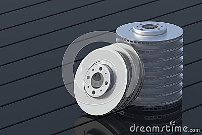 Heap of brake disks on black boards Stock Photo